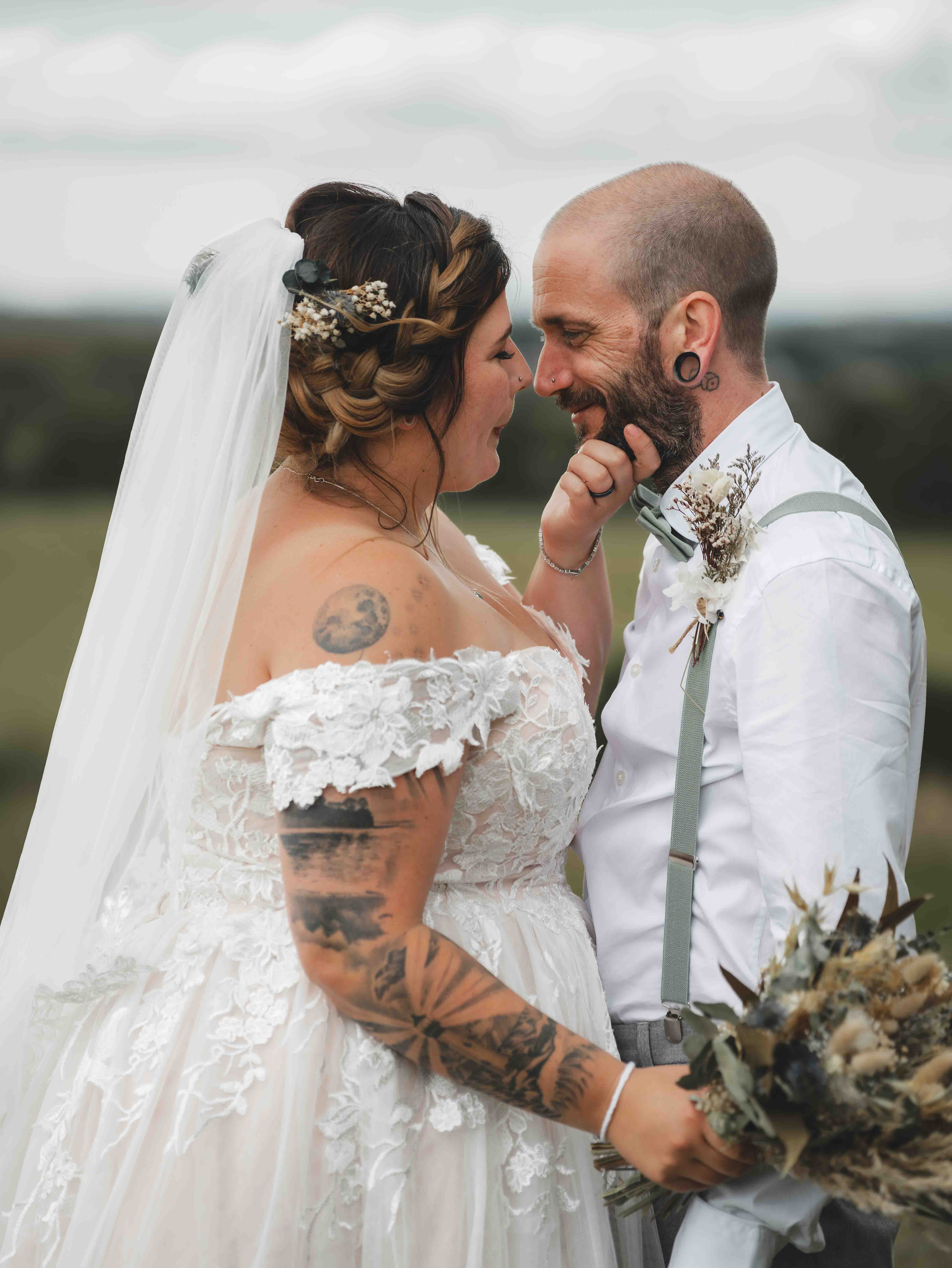 Close-up of Cessca and Tony laughing face to face in a playful intimate moment