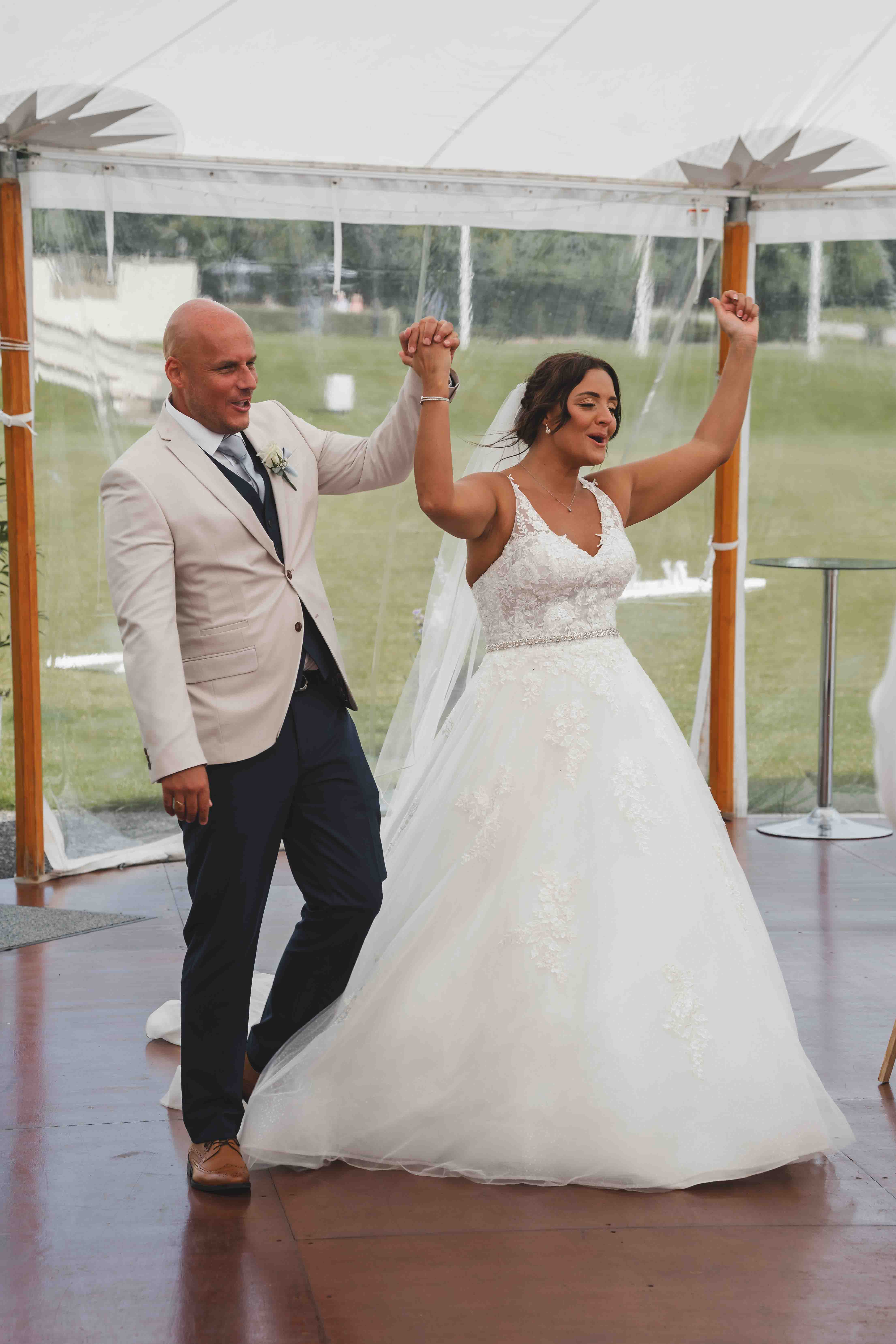 Candid documentary moment during Lauren and John's summer wedding