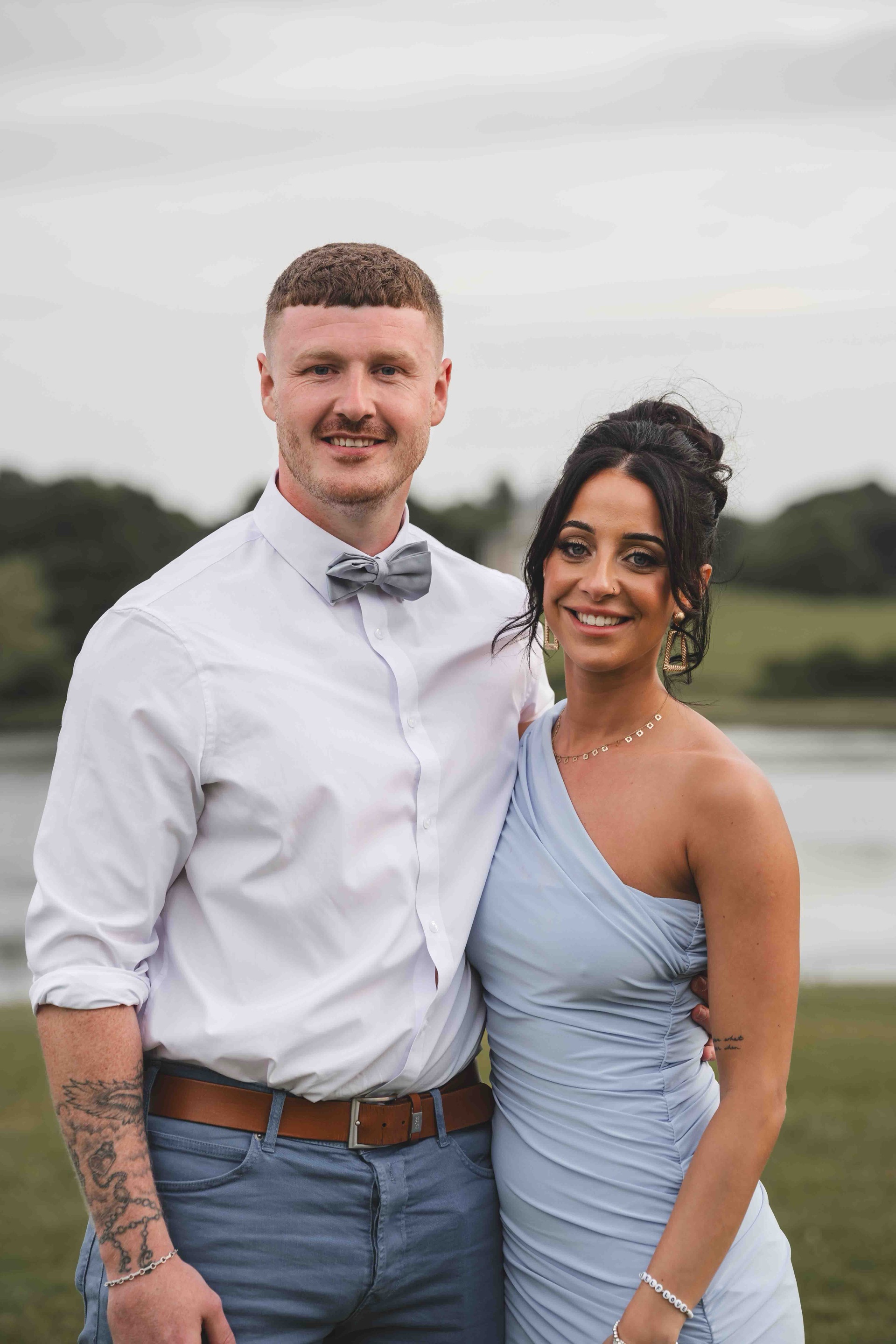 Lauren and John celebrating at their Northumberland summer wedding reception