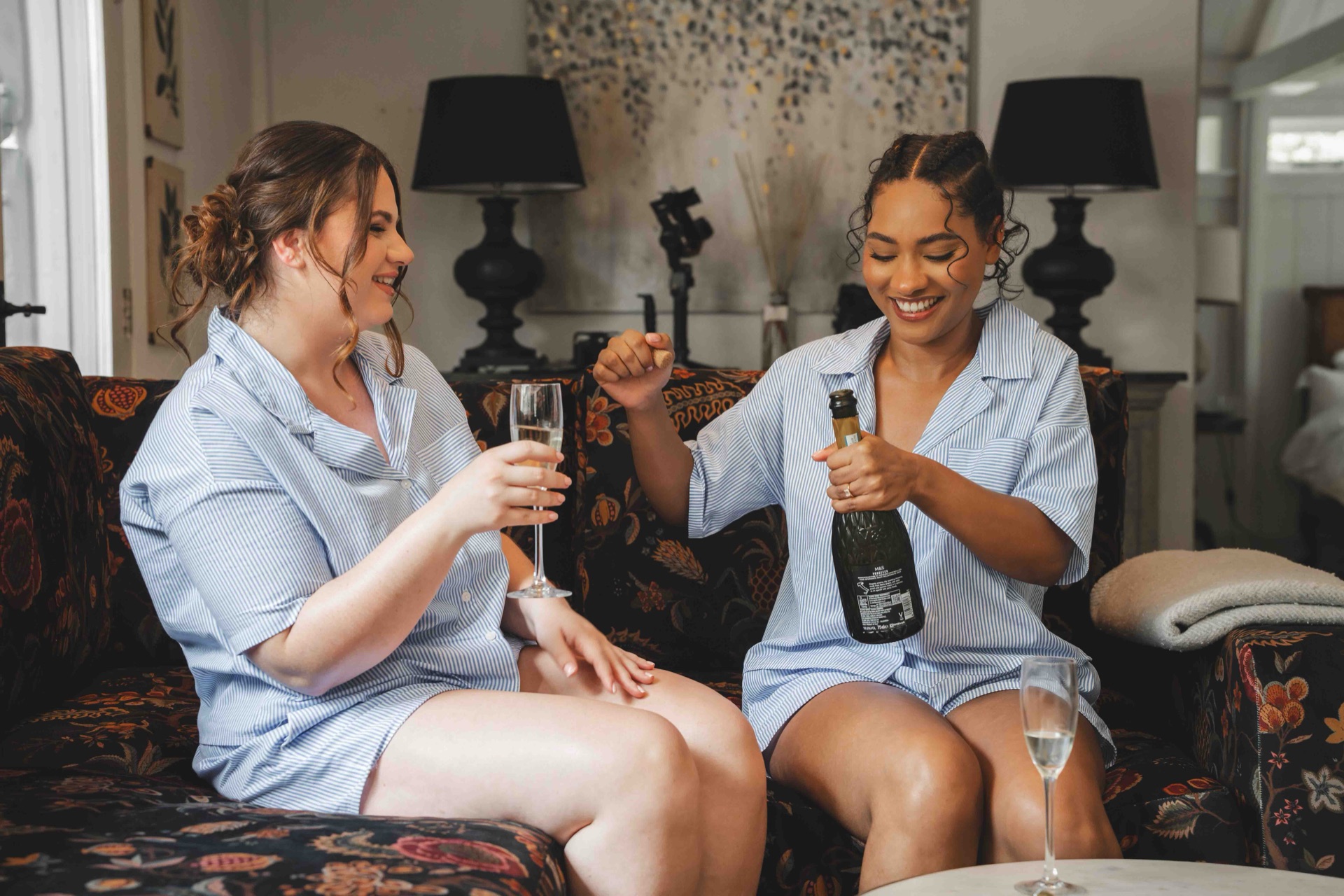 Wedding reception guests laughing — candid documentary coverage