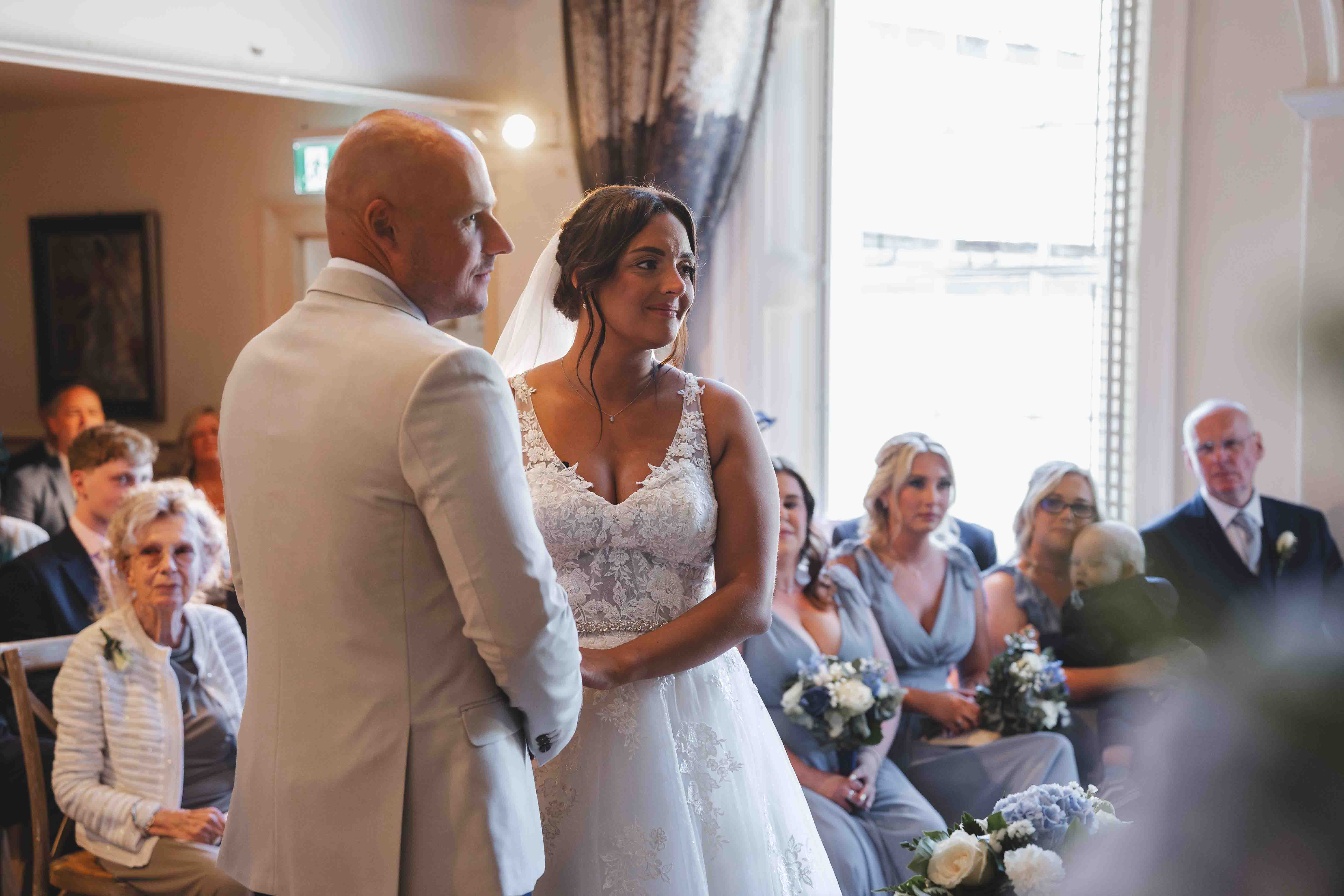 Wedding ceremony amongst wildflower meadows — Hardwick Hall Hotel