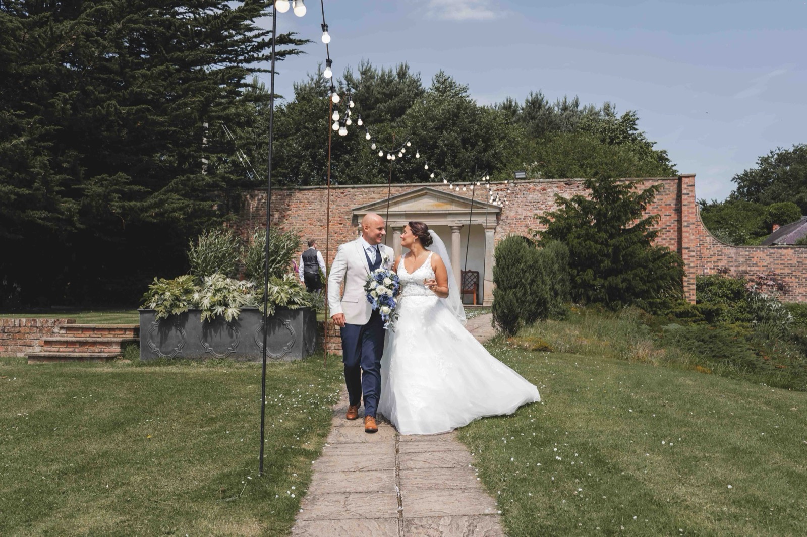 Guests celebrating after ceremony — Hardwick Hall Hotel grounds