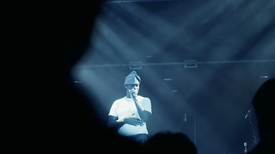 MOBO Fringe performer on stage under blue lighting